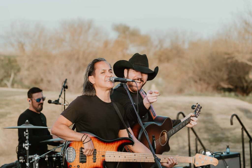 Live band entertaining guests during a Virginia Beach corporate event with guitars and vocals.