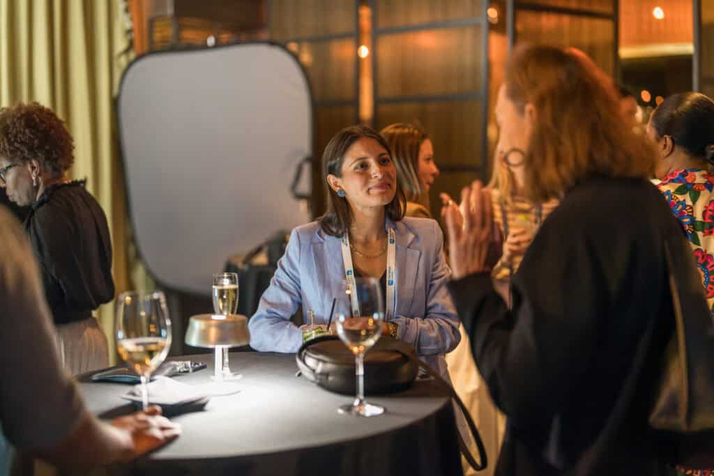 Professionals networking over drinks during a Virginia Beach business event and mixer.