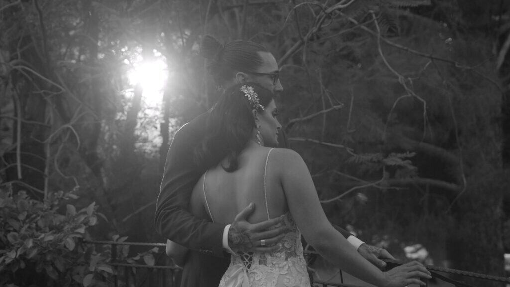 Bride and groom share a romantic moment at sunset during their Virginia Beach wedding.  Photo taken by a Virginia Beach Videographer.